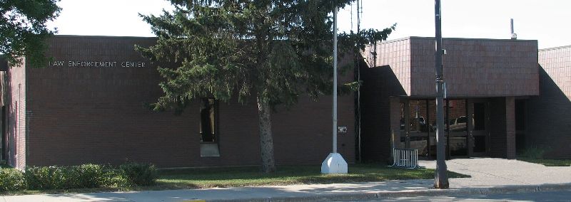 brick building with a tree in front of it 