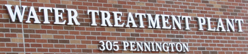 water treatment plant sign on a brick building