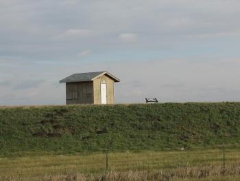 small shed in a field 