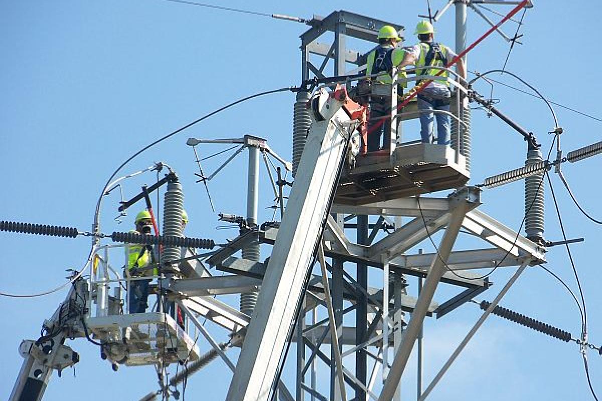 men working on electrical wires