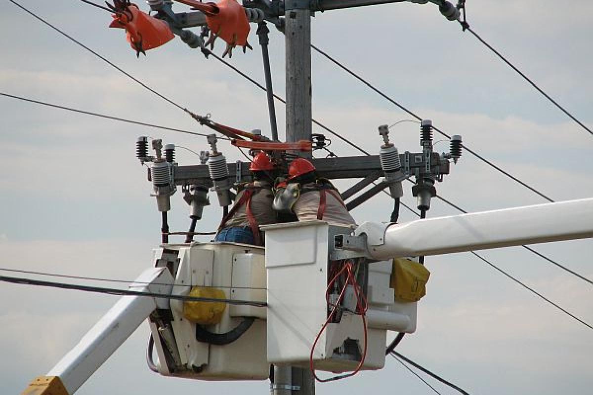 men working on electrical wires
