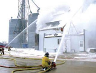 firefighters putting out a burning building