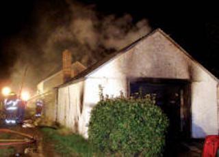 firefighters putting out a burning building