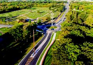 birds-eye view of tress, road, and rotary
